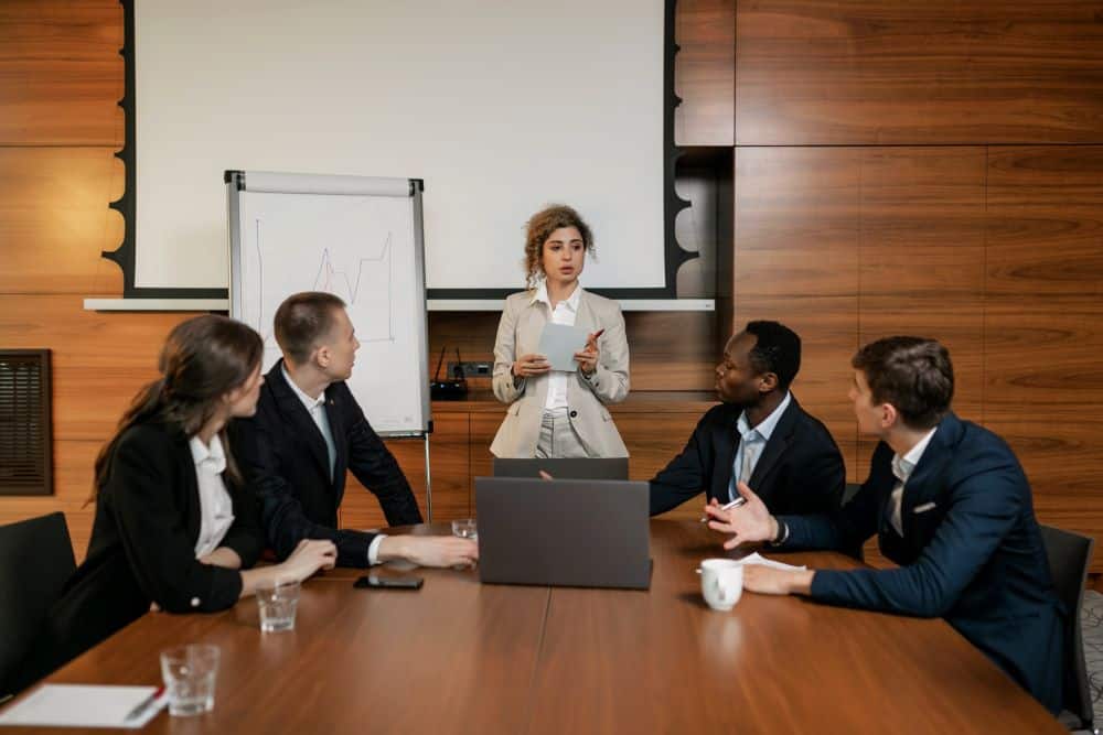 Boardroom of leaders receiving executive coaching