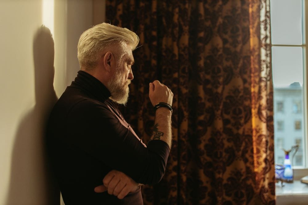 light on man and shadow in the background representing inner balance