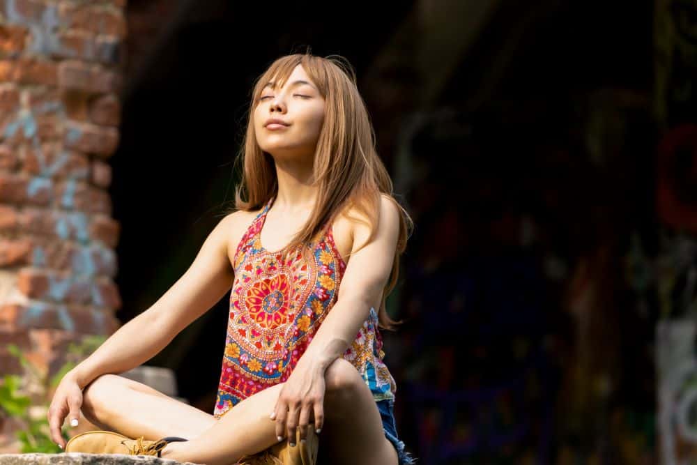 Lady taking time to meditate and find inner peace