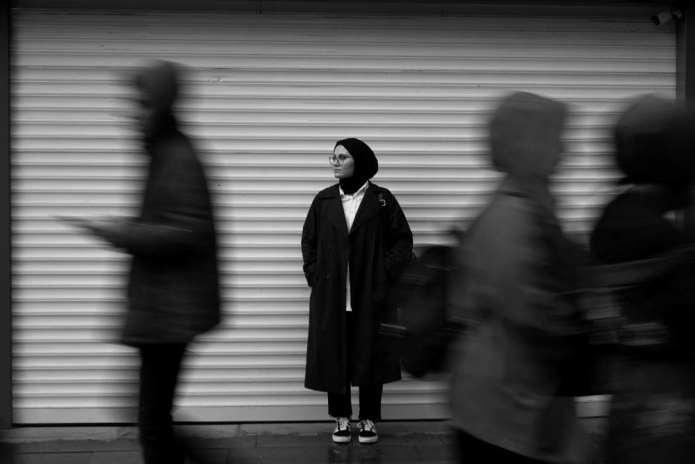 Someone having an existential crisis on a busy street - understanding the self